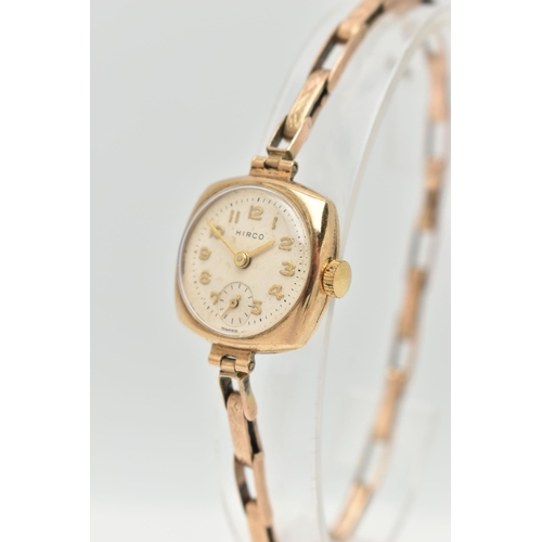 A 1950'S 9CT GOLD HIRCO WRISTWATCH, the circular white/cream dial with ...