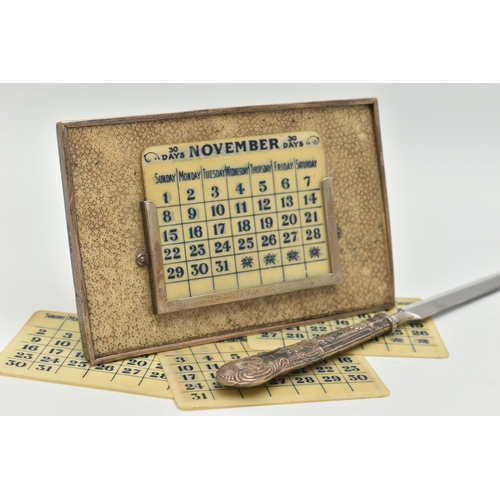 122 - A GEORGE V SILVER MOUNTED SHAGREEN PERPETUAL DESK CALENDAR OF RECTANGULAR FORM, with seven double si... 