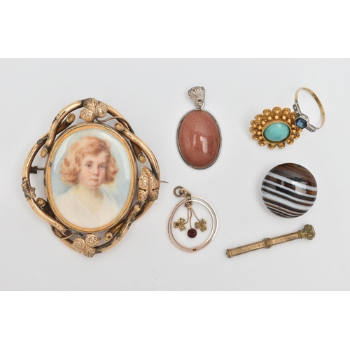 81 - A SMALL ASSORTMENT OF ITEMS, to include a yellow metal open work lavalier pendant, set with garnet a... 