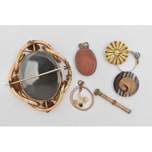 81 - A SMALL ASSORTMENT OF ITEMS, to include a yellow metal open work lavalier pendant, set with garnet a... 