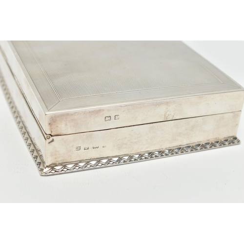 94 - AN EARLY 20TH CENTURY SILVER CIGARETTE BOX, table top box, of a rectangular form, engine turned patt... 