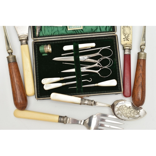 150 - A CASED SEWING KIT AND CUTLERY, the black case with green suede interior, together with button hook,... 