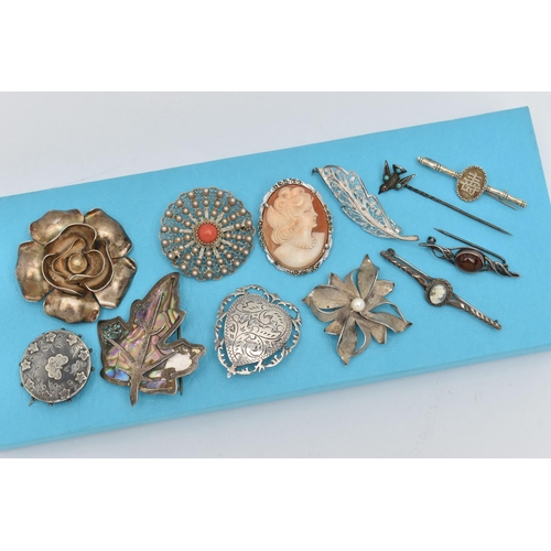 162 - ELEVEN BROOCHES AND A STICKPIN, to include a late Victorian silver circular brooch with butterfly an... 