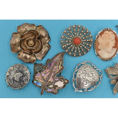 162 - ELEVEN BROOCHES AND A STICKPIN, to include a late Victorian silver circular brooch with butterfly an... 