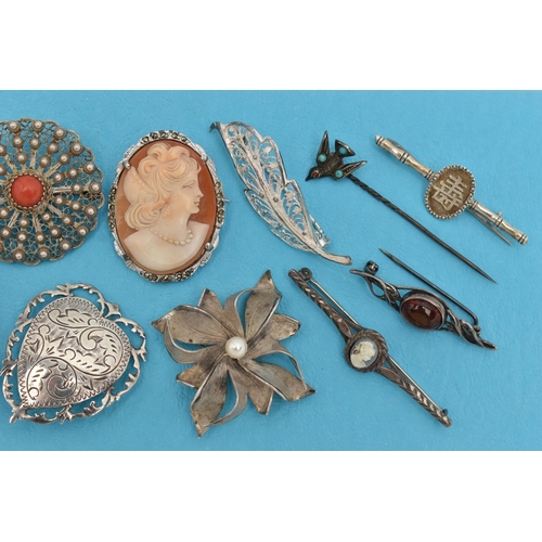 162 - ELEVEN BROOCHES AND A STICKPIN, to include a late Victorian silver circular brooch with butterfly an... 