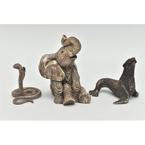 163 - THREE ANIMAL ORNAMENTS, the first a filled silver seated elephant, with silver hallmark, the second ... 