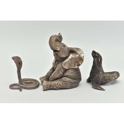 163 - THREE ANIMAL ORNAMENTS, the first a filled silver seated elephant, with silver hallmark, the second ... 