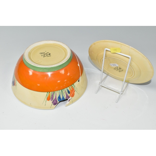 381 - TWO PIECES OF CLARICE CLIFF BIZARRE POTTERY BADLY DAMAGED AND IN NEED OF RESTORATION, comprising a C... 