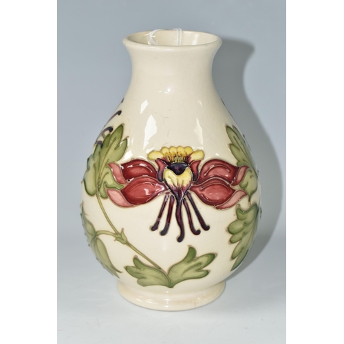 384 - A MOORCROFT POTTERY 'COLUMBINE' VASE, the baluster vase decorated with red and yellow columbine flow... 