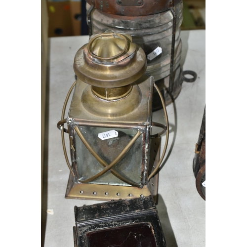 447 - A GROUP OF LAMPS AND LANTERNS, to include a carriage lamp, a nautical lantern, a railway lantern mar... 