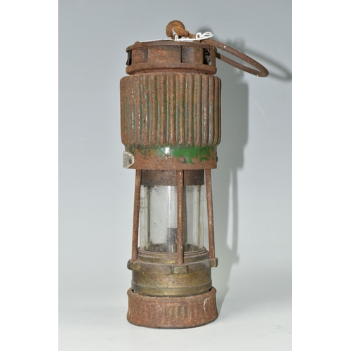 484 - A VINTAGE PATTERSON TYPE MINER'S LAMP, in rusted condition, lettering to top indistinct, bears stamp... 