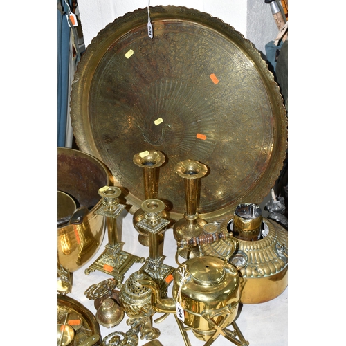 506 - A LARGE QUANTITY OF BRASSWARE, comprising a large circular table top/drinks tray, decorated with a M... 