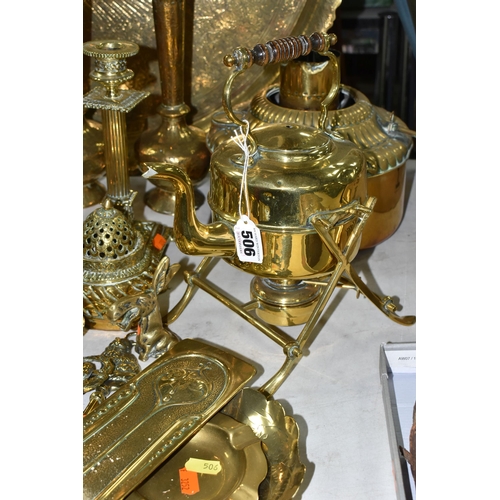 506 - A LARGE QUANTITY OF BRASSWARE, comprising a large circular table top/drinks tray, decorated with a M... 