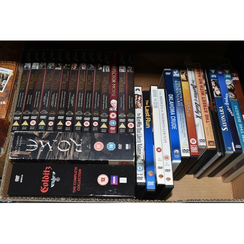 518 - SIX BOXES OF DVDS containing over 310 miscellaneous Film and TV titles including box sets