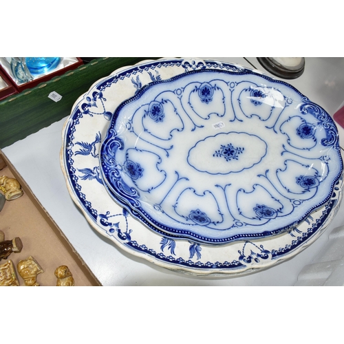 543 - TWO BOXES OF CERAMICS, to include two flow blue oval meat plates, a large Clarendon blue and white m... 