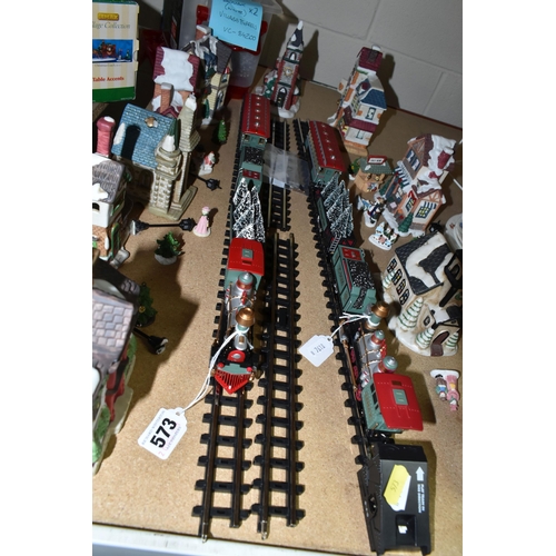 573 - TWO LEMAX CHRISTMAS VILLAGE TRAIN SETS AND WINTER BUILDINGS ETC, to include three churches, three in... 