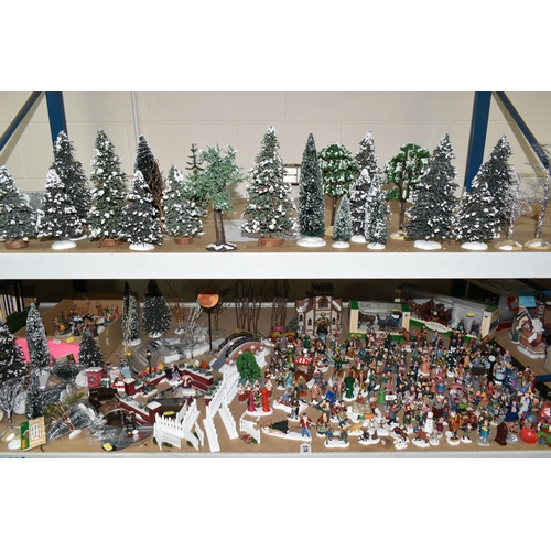 576 - A COLLECTION OF CHRISTMAS VILLAGE FIGURES, TREES AND OTHER ITEMS, to include over one hundred figure... 