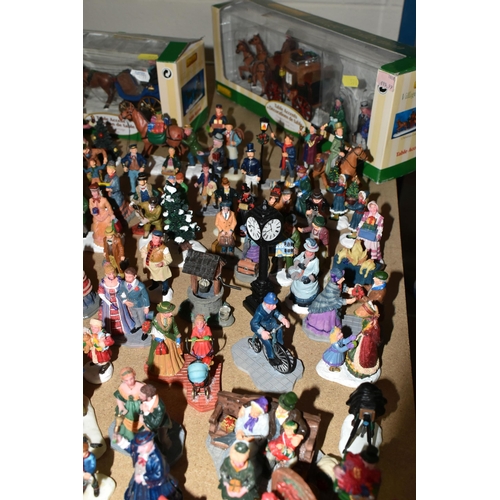 576 - A COLLECTION OF CHRISTMAS VILLAGE FIGURES, TREES AND OTHER ITEMS, to include over one hundred figure... 