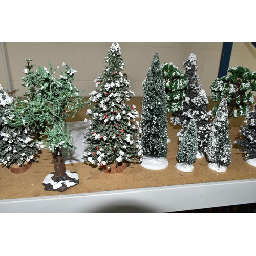 576 - A COLLECTION OF CHRISTMAS VILLAGE FIGURES, TREES AND OTHER ITEMS, to include over one hundred figure... 