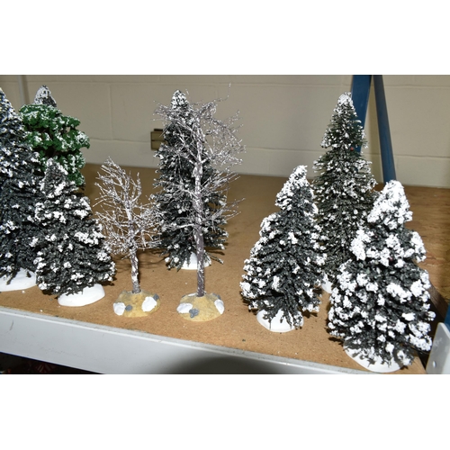 576 - A COLLECTION OF CHRISTMAS VILLAGE FIGURES, TREES AND OTHER ITEMS, to include over one hundred figure... 