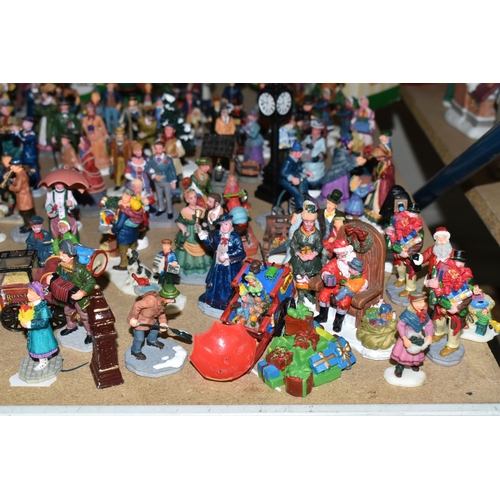 576 - A COLLECTION OF CHRISTMAS VILLAGE FIGURES, TREES AND OTHER ITEMS, to include over one hundred figure... 