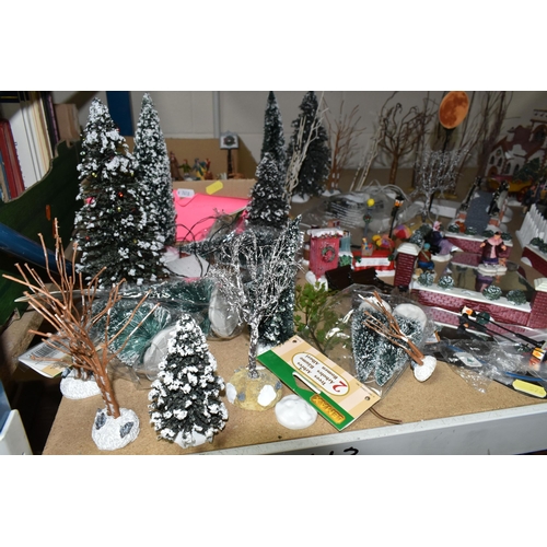 576 - A COLLECTION OF CHRISTMAS VILLAGE FIGURES, TREES AND OTHER ITEMS, to include over one hundred figure... 