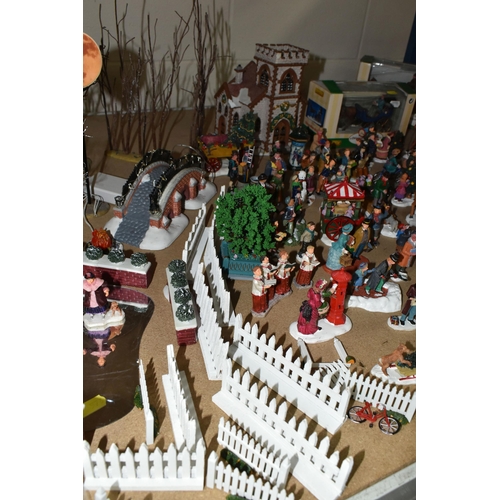 576 - A COLLECTION OF CHRISTMAS VILLAGE FIGURES, TREES AND OTHER ITEMS, to include over one hundred figure... 