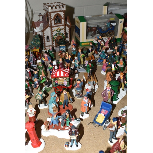 576 - A COLLECTION OF CHRISTMAS VILLAGE FIGURES, TREES AND OTHER ITEMS, to include over one hundred figure... 