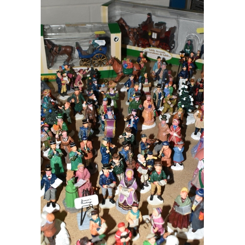 576 - A COLLECTION OF CHRISTMAS VILLAGE FIGURES, TREES AND OTHER ITEMS, to include over one hundred figure... 