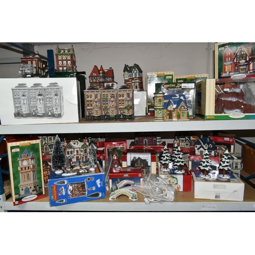 586 - A COLLECTION OF BOXED CERAMIC CHRISTMAS VILLAGE BUILDINGS, by Department 56, Lemax and Copperfield K... 