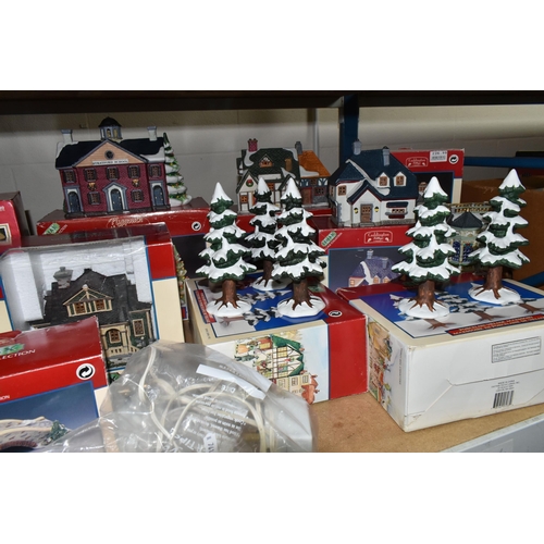 586 - A COLLECTION OF BOXED CERAMIC CHRISTMAS VILLAGE BUILDINGS, by Department 56, Lemax and Copperfield K... 