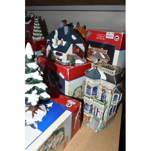 586 - A COLLECTION OF BOXED CERAMIC CHRISTMAS VILLAGE BUILDINGS, by Department 56, Lemax and Copperfield K... 