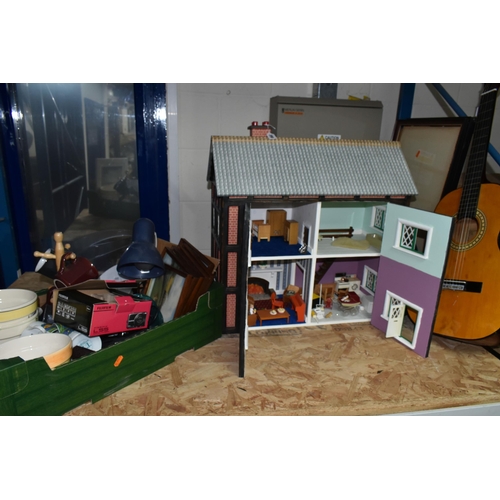 590 - A MODERN KIT BUILT WOODEN DOLLS HOUSE, front opening to reveal four rooms over two floors, construct... 