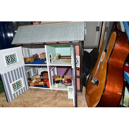 590 - A MODERN KIT BUILT WOODEN DOLLS HOUSE, front opening to reveal four rooms over two floors, construct... 