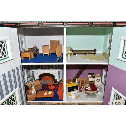 590 - A MODERN KIT BUILT WOODEN DOLLS HOUSE, front opening to reveal four rooms over two floors, construct... 