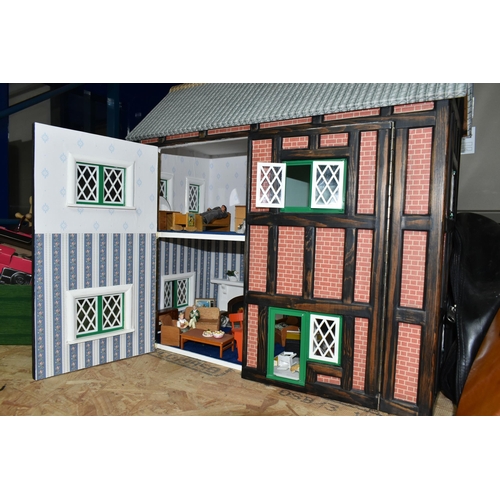 590 - A MODERN KIT BUILT WOODEN DOLLS HOUSE, front opening to reveal four rooms over two floors, construct... 