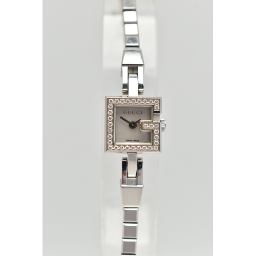 29 - A GUCCI DIAMOND SET WRISTWATCH, the mother of pearl square dial, signed 'Gucci Swiss Made', square c... 