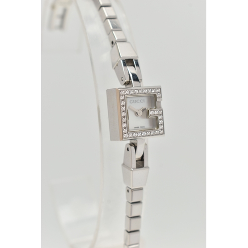 29 - A GUCCI DIAMOND SET WRISTWATCH, the mother of pearl square dial, signed 'Gucci Swiss Made', square c... 