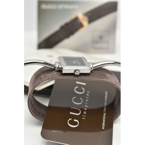 27 - TWO GUCCI WATCHES, to include a wristwatch with a black square dial, the dial is signed 'GUCCI Swiss... 