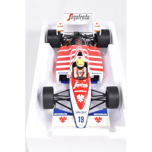 29 - TWO BOXED MINICHAMPS AYRTON SENNA 1:18 SCALE DIECAST MODEL VEHICLES, the first a Toleman Hart TG184 ... 