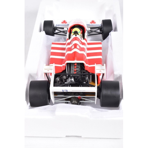 29 - TWO BOXED MINICHAMPS AYRTON SENNA 1:18 SCALE DIECAST MODEL VEHICLES, the first a Toleman Hart TG184 ... 