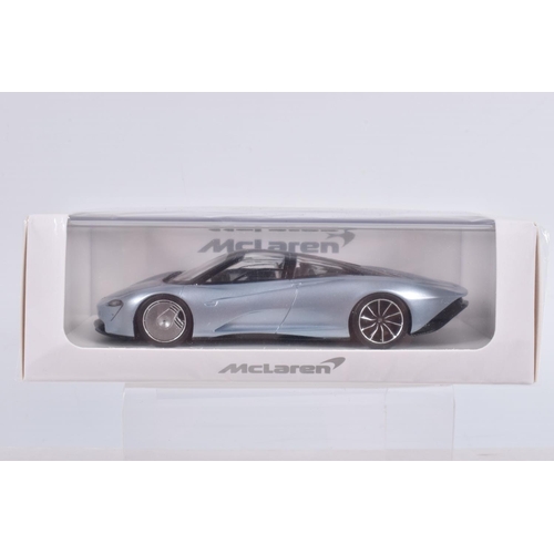 154 - THREE BOXED TSM MODEL MCLAREN MODEL VEHICLES TOGETHER WITH ONE UNBRANDED MCLAREN MODEL, the first is... 