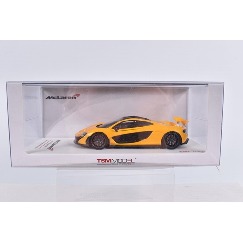 154 - THREE BOXED TSM MODEL MCLAREN MODEL VEHICLES TOGETHER WITH ONE UNBRANDED MCLAREN MODEL, the first is... 