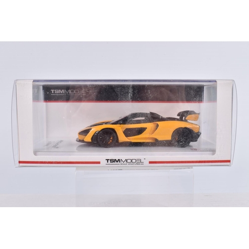 154 - THREE BOXED TSM MODEL MCLAREN MODEL VEHICLES TOGETHER WITH ONE UNBRANDED MCLAREN MODEL, the first is... 