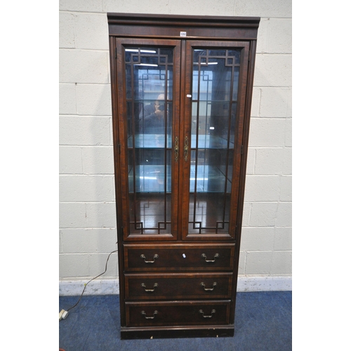 1202 - A DREXEL HERITAGE CHIPPENDALE BOOKCASE, the two glazed doors enclosing three adjustable shelves, abo... 