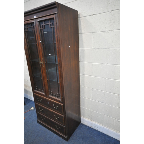 1202 - A DREXEL HERITAGE CHIPPENDALE BOOKCASE, the two glazed doors enclosing three adjustable shelves, abo... 