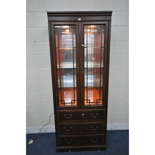 1202 - A DREXEL HERITAGE CHIPPENDALE BOOKCASE, the two glazed doors enclosing three adjustable shelves, abo... 