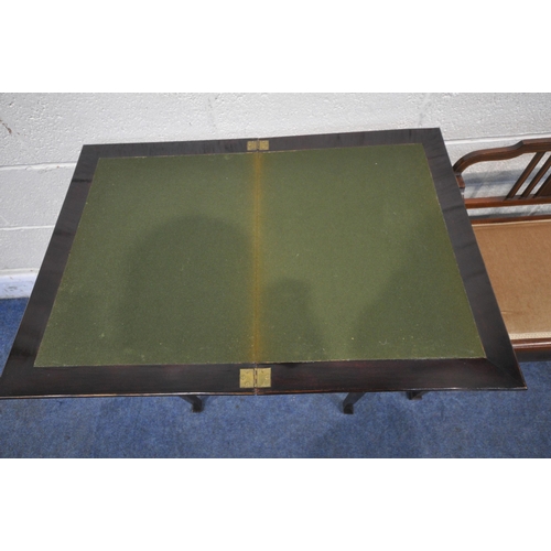 1204 - A 20TH CENTURY MAHOGANY FOLD OVER GAMES TABLE, the fold over top enclosing a green baize, with a sin... 