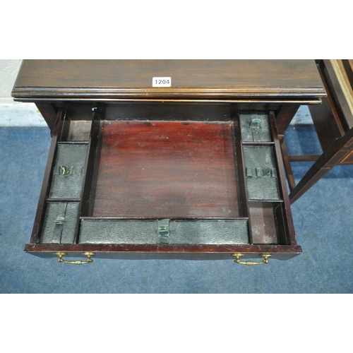 1204 - A 20TH CENTURY MAHOGANY FOLD OVER GAMES TABLE, the fold over top enclosing a green baize, with a sin... 