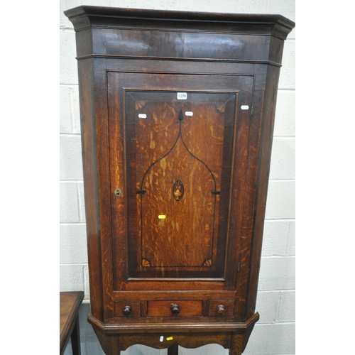 1206 - A GEORGIAN OAK CORNER CUPBOARD, with a single cupboard door above a single drawer and two dummy draw... 